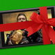 Death Stranding plays on a Steam Deck that's wrapped in a red bow.